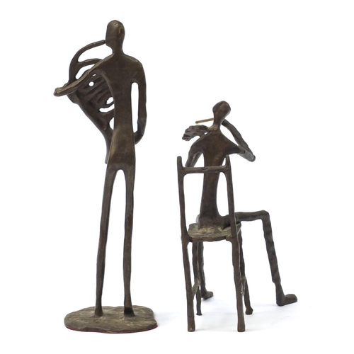 182 - Two Modernist patinated bronze musicians in the style of Alberto Giacometti, 30.5cm high