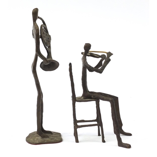 182 - Two Modernist patinated bronze musicians in the style of Alberto Giacometti, 30.5cm high