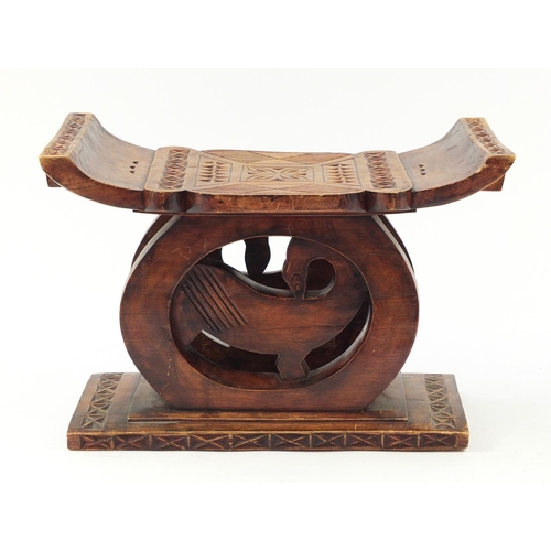 529 - Large tribal interest carved hardwood headrest, 39cm H x 57cm W x 32.5D