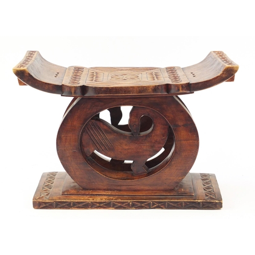 529 - Large tribal interest carved hardwood headrest, 39cm H x 57cm W x 32.5D