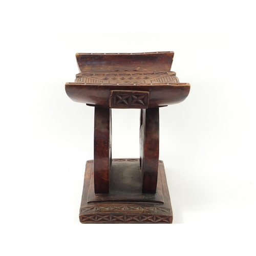 529 - Large tribal interest carved hardwood headrest, 39cm H x 57cm W x 32.5D