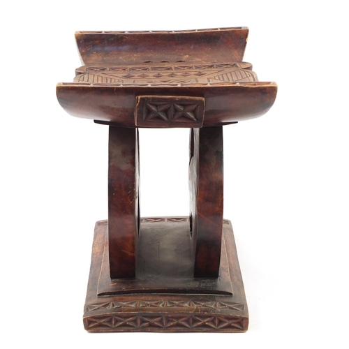 529 - Large tribal interest carved hardwood headrest, 39cm H x 57cm W x 32.5D