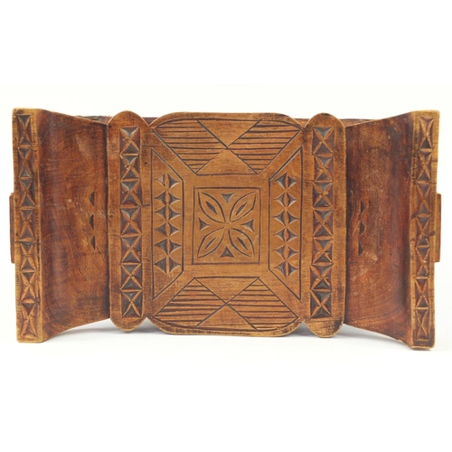 529 - Large tribal interest carved hardwood headrest, 39cm H x 57cm W x 32.5D