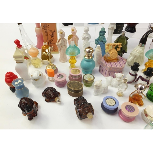 1404 - Collection of novelty Avon perfume bottles, some with boxes, the largest 23.5cm high