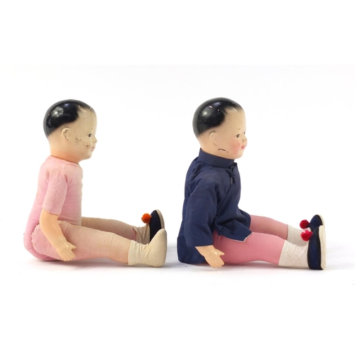 716 - Pair of Chinese composite dolls with jointed limbs, each 38cm high