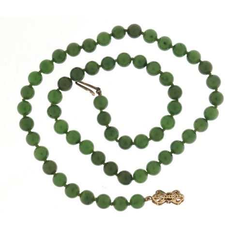 1306 - Chinese spinach green jade bead necklace with 9ct gold clasp, 45cm in length