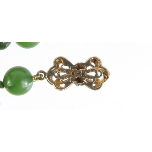 1306 - Chinese spinach green jade bead necklace with 9ct gold clasp, 45cm in length