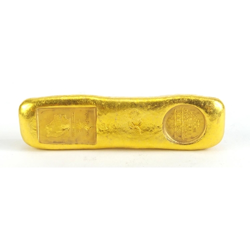 1153 - Chinese gold coloured metal ingot, impressed marks, 9.5cm wide