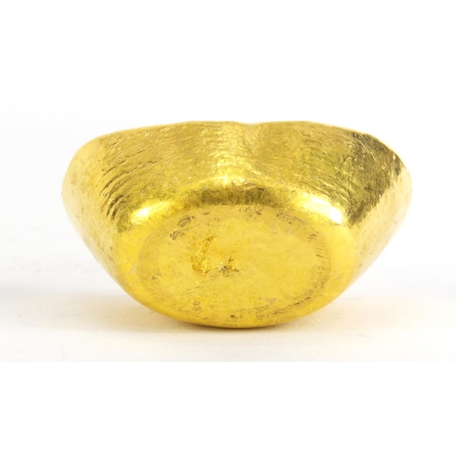 399 - Chinese gold coloured metal ingot, impressed marks, 5.5cm wide