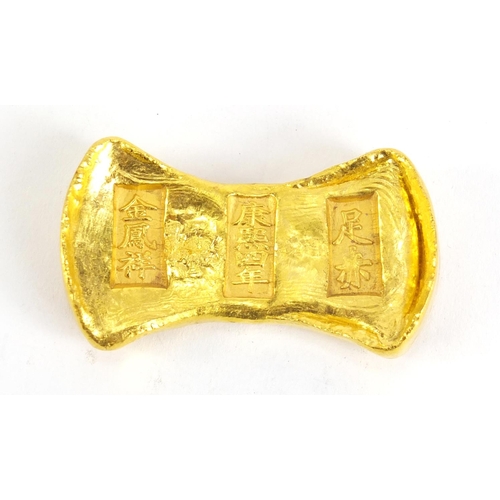 314 - Chinese gold coloured metal ingot, impressed marks, 6cm wide