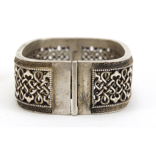 1099 - Chinese silver coloured metal bangle, impressed marks to the inside, 7cm wide