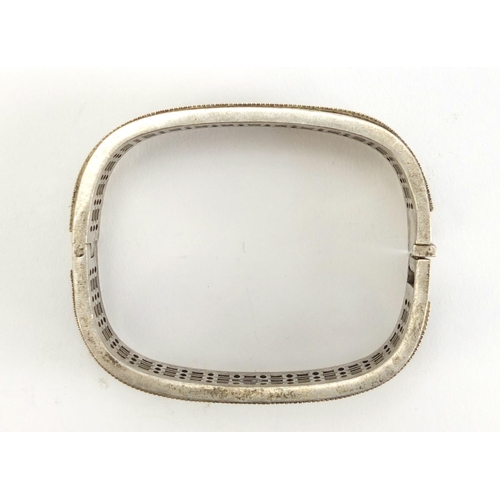 1099 - Chinese silver coloured metal bangle, impressed marks to the inside, 7cm wide