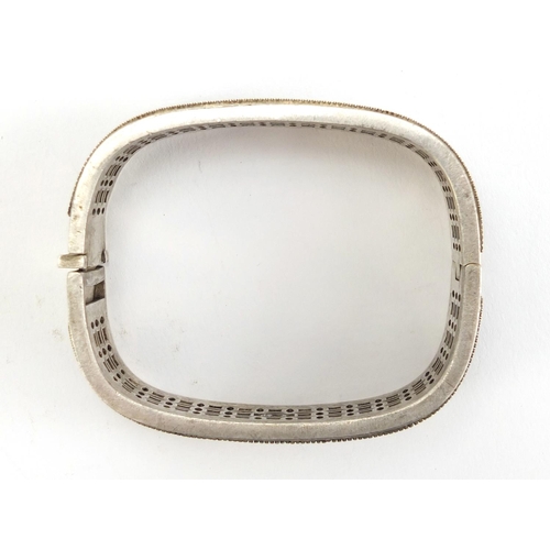 1099 - Chinese silver coloured metal bangle, impressed marks to the inside, 7cm wide