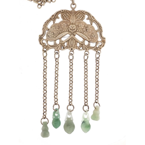 974 - Chinese silver coloured metal butterfly design chatelaine with jade drops and one other, the largest... 