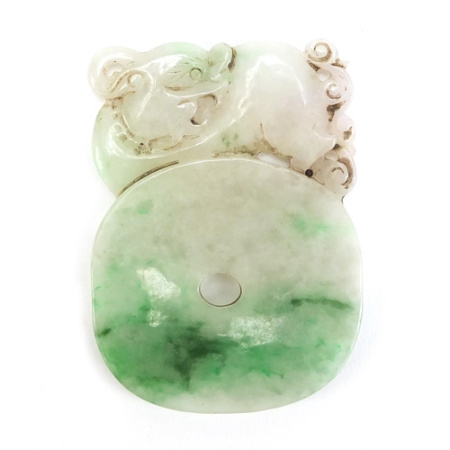 493 - Chinese green and white jade carving of a Foo dog and two bats, 7.5cm high