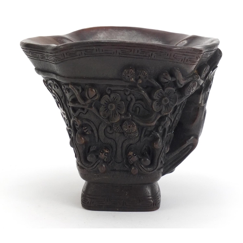 1031 - Chinese libation cup carved with water dragons and flowers, 12.5cm high