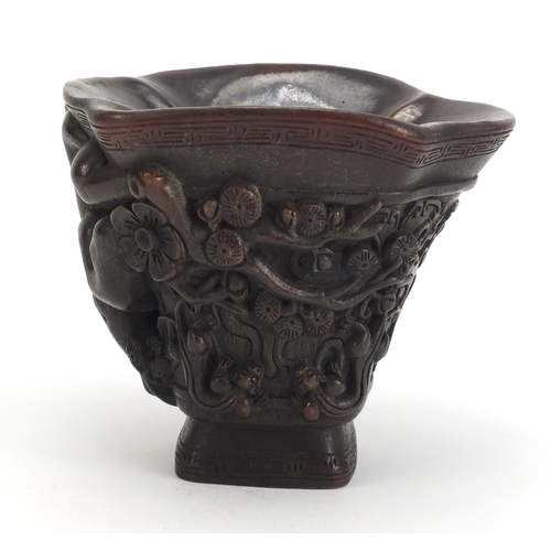 1031 - Chinese libation cup carved with water dragons and flowers, 12.5cm high