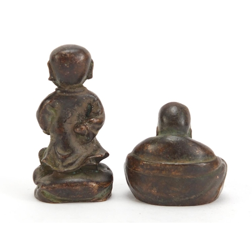 1332 - Two Chinese patinated bronzes comprising a young boy and Buddha, the largest 5cm high