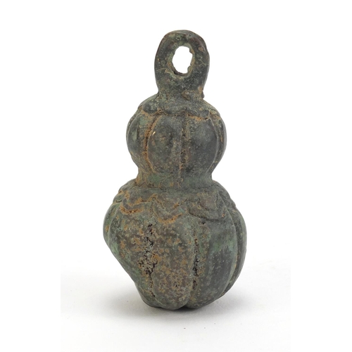 526 - Chinese archaic style patinated bronze double gourd weight, 7.5cm high