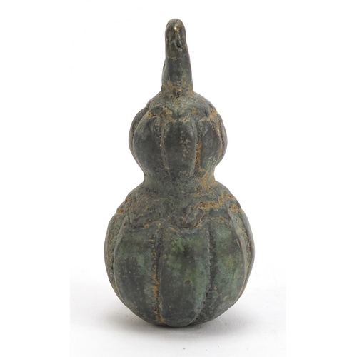 526 - Chinese archaic style patinated bronze double gourd weight, 7.5cm high