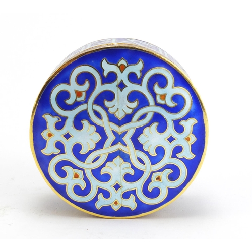 1447 - Islamic gilt metal box and cover enamelled with calligraphy, 8cm in diameter