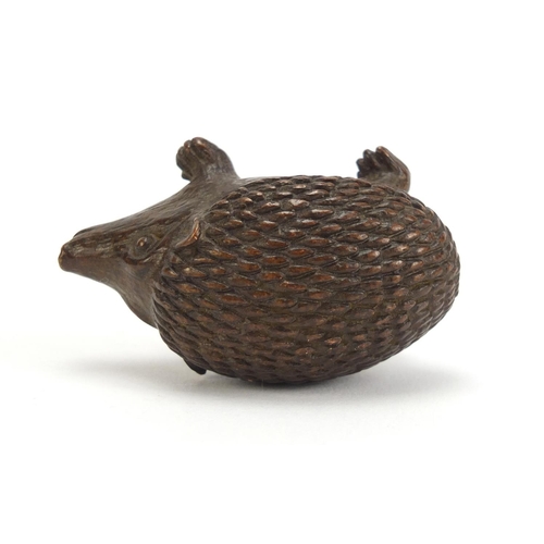 1475 - Japanese patinated bronze hedgehog, impressed marks to the base, 5.5cm in length