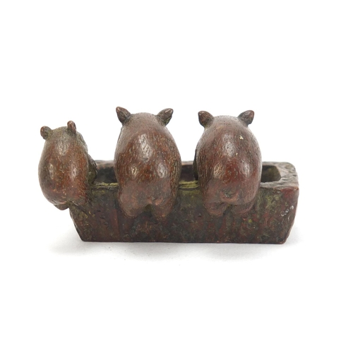 636 - Japanese patinated bronze okimono of three piglets in a trough, impressed character marks to the bas... 