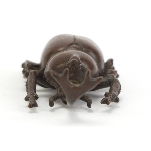 499 - Japanese patinated bronze rhino horn beetle, impressed marks to the base, 7.5cm in length