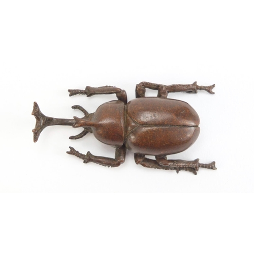 499 - Japanese patinated bronze rhino horn beetle, impressed marks to the base, 7.5cm in length