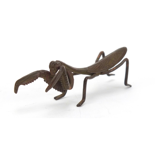 747 - Japanese patinated bronze praying mantis, 7.5cm in length