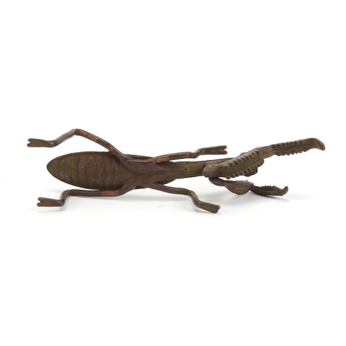 747 - Japanese patinated bronze praying mantis, 7.5cm in length