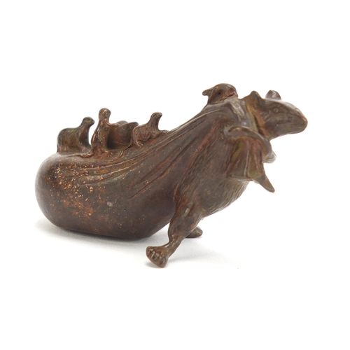 746 - Japanese patinated bronze rat pulling a sack, impressed character marks to the base, 7cm in length