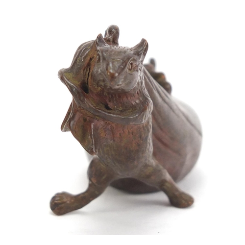 746 - Japanese patinated bronze rat pulling a sack, impressed character marks to the base, 7cm in length