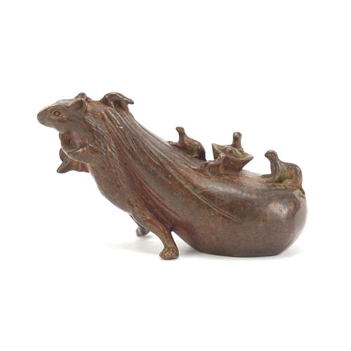 746 - Japanese patinated bronze rat pulling a sack, impressed character marks to the base, 7cm in length