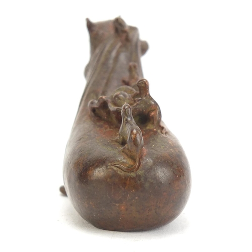 746 - Japanese patinated bronze rat pulling a sack, impressed character marks to the base, 7cm in length