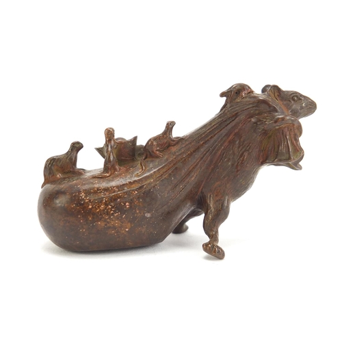 746 - Japanese patinated bronze rat pulling a sack, impressed character marks to the base, 7cm in length