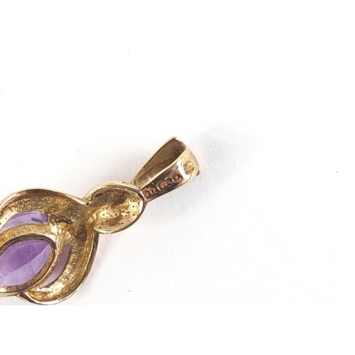 1064 - 9ct gold amethyst pendant, 2cm in length, 1.0g