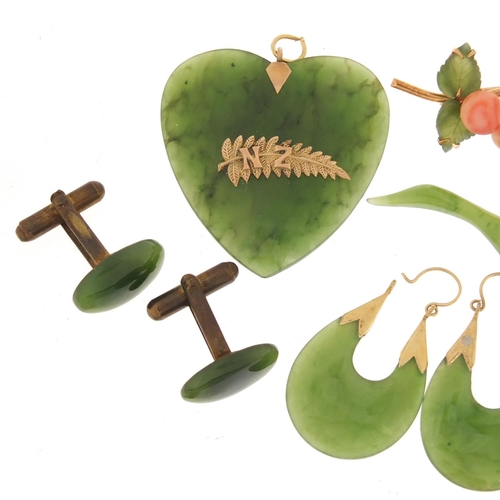 1396 - Spinach green jade jewellery including floral brooch, pair of earrings and a pair of cufflinks, the ... 