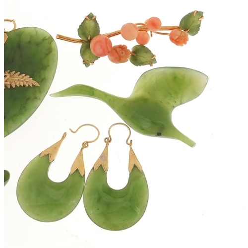 1396 - Spinach green jade jewellery including floral brooch, pair of earrings and a pair of cufflinks, the ... 