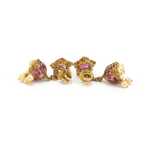 881 - Pair of unmarked gold pink sapphire and pearl earrings with screw backs, 3.5cm in length, 6.2g