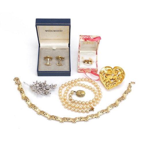 1402 - Costume jewellery including a Christian Lacroix love heart brooch, simulated pearl necklace and a pa... 