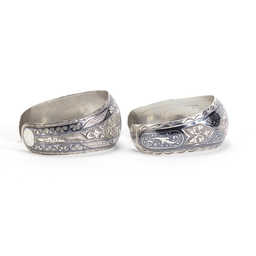 727 - Two Russian silver Niello work bangles, each with impressed Kokoshnik marks, 39.5g