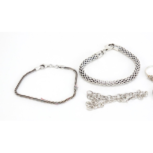 1149 - Silver jewellery including four bracelets and five rings, 34.7g