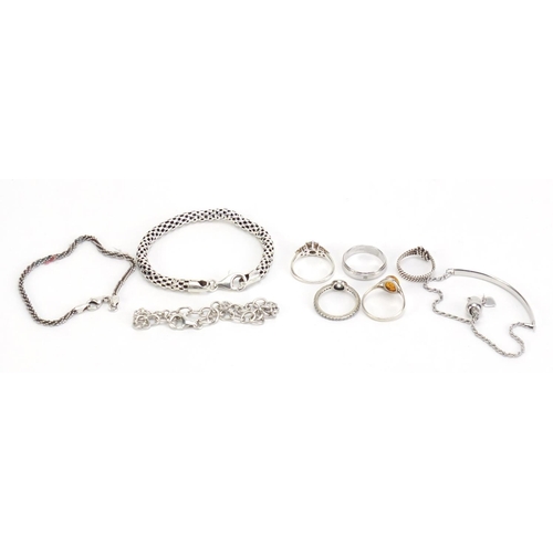 1149 - Silver jewellery including four bracelets and five rings, 34.7g