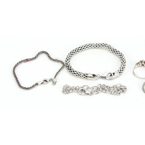 1149 - Silver jewellery including four bracelets and five rings, 34.7g