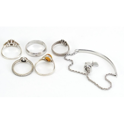 1149 - Silver jewellery including four bracelets and five rings, 34.7g