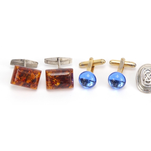 1400 - Four pairs of cufflinks including silver and enamel and amber