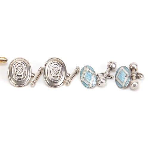 1400 - Four pairs of cufflinks including silver and enamel and amber