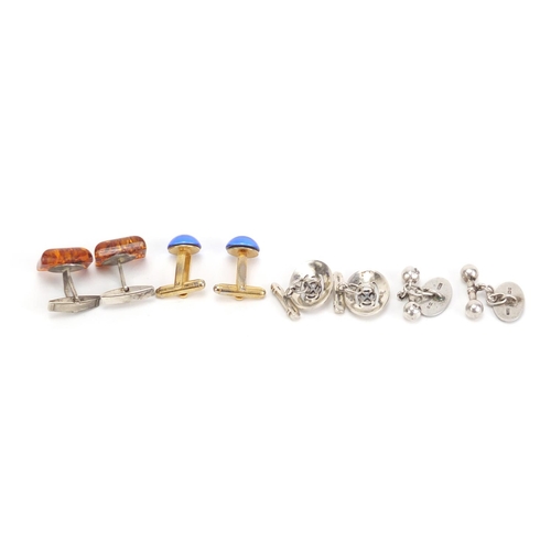 1400 - Four pairs of cufflinks including silver and enamel and amber