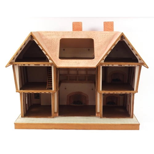 723 - Large Tudor design doll's house, 79cm H x 92cm W x 53.5cm D